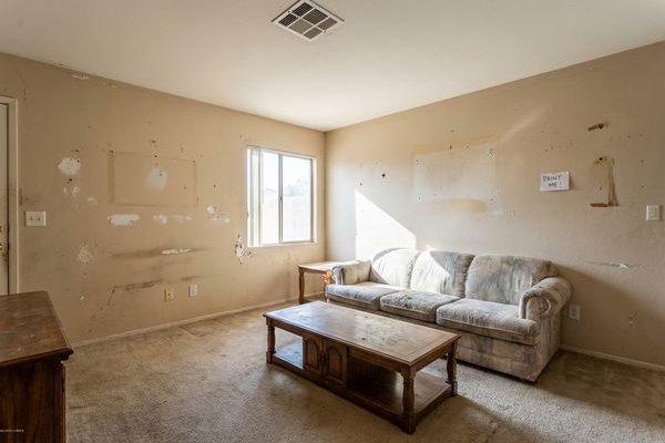 Dated living room with worn paint